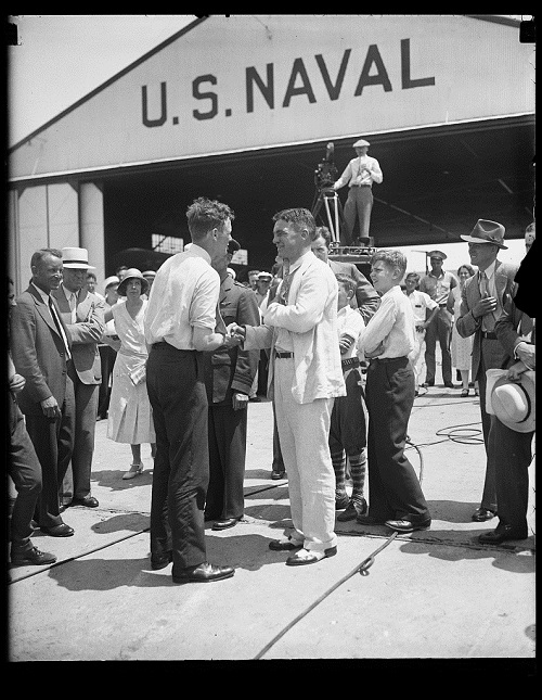 Charles Lindbergh (center left) at a US naval hangar: The USHMM is asking citizen historians to conduct research on a variety of historical topics related to the Holocaust, including Lindbergh's famous 1941 speech in Des Moines, Iowa. Credit: Harris & Ewing Collection (Library of Congress)