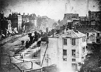 Credit: Public domain, downloaded from Wikimedia Commons.  Boulevard du Temple, Paris, 3rd arrondissement, by Louis Daguerre,” is a high-resolution digital image of a 1838 daguerreotype, reproduced here as a halftone. It is thought to be the earliest photograph with a human subject.
